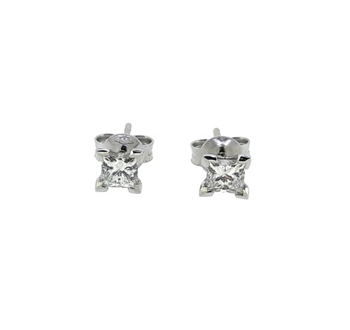 Lot 131 - A pair of princess cut diamond ear studs