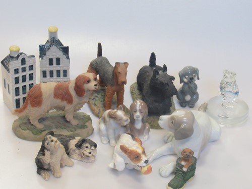 Lot 184 - A collection of animal figurines, mainly dogs,...