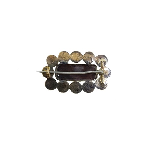 Lot 32 - A Georgian coral set memorial brooch