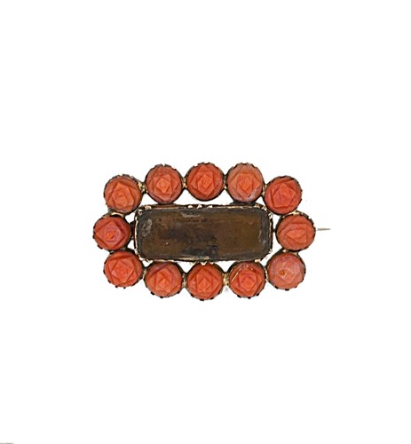 Lot 32 - A Georgian coral set memorial brooch