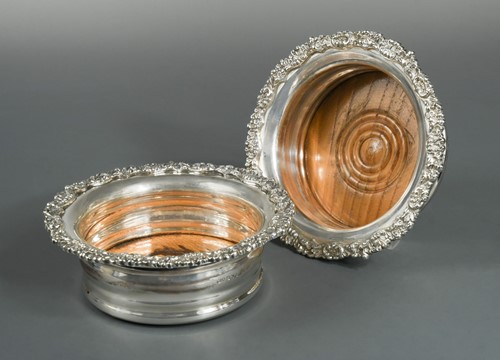 Lot 581 - A pair of mid 20th century silver bottle coasters