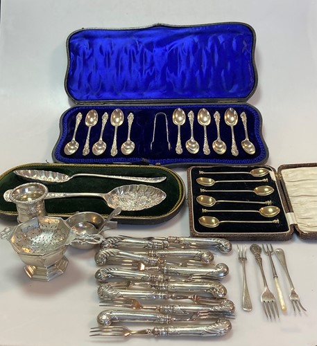 Lot 249 - A collection of silver flatware including a...