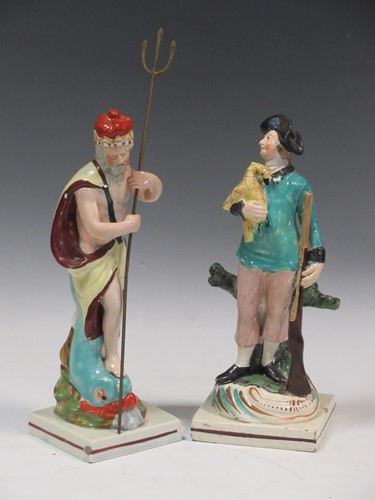 Lot 131 - A pearlware figure of Neptune and another...