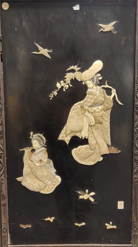 Lot 576 - A pair of framed Japanese black lacquer panels...