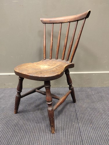 Lot 686 - A child's elm chair