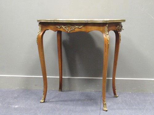 Lot 565 - A Louis XV style marquetry centre table with...