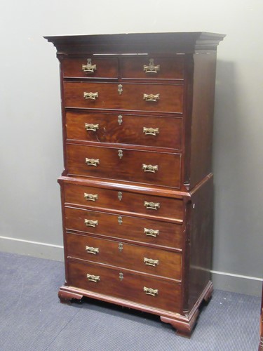 Lot 660 - A George III mahogany chest on chest raised on...