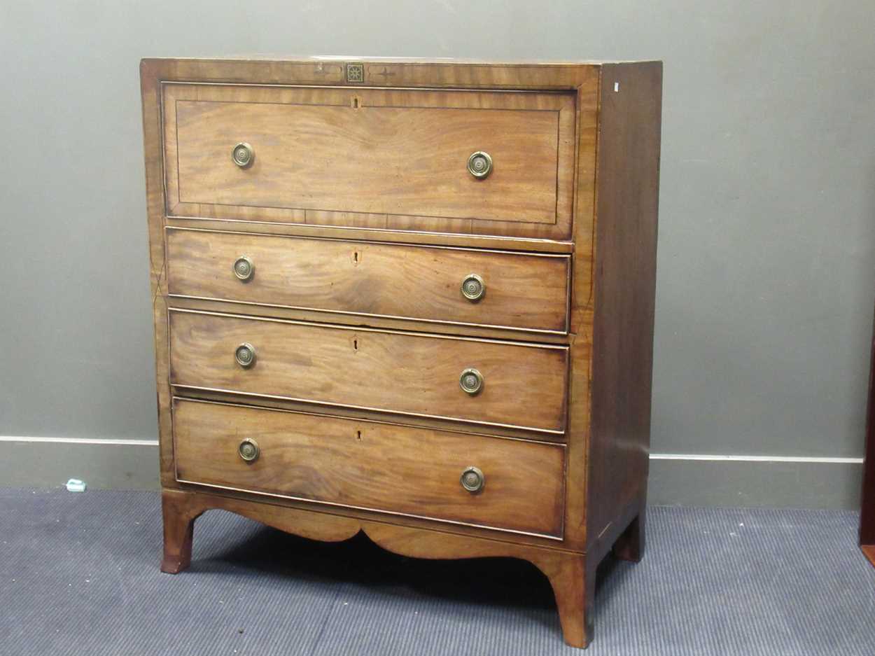 Lot 677 - An early 19th century mahogany secetaire, the...