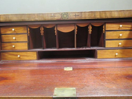 Lot 677 - An early 19th century mahogany secetaire, the...