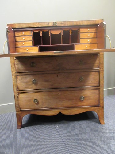 Lot 677 - An early 19th century mahogany secetaire, the...