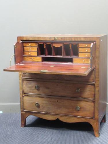 Lot 677 - An early 19th century mahogany secetaire, the...