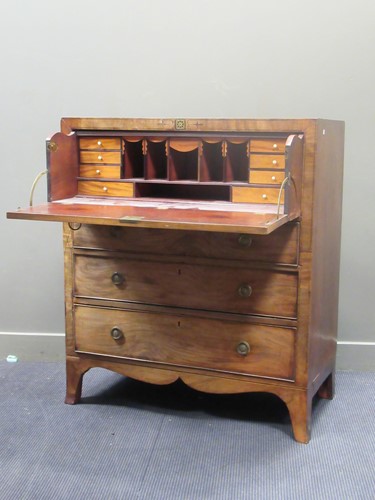 Lot 677 - An early 19th century mahogany secetaire, the...