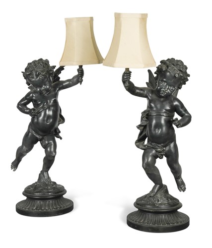 Lot 449 - A pair of bronzed spelter cherubic table lamps, 20th century