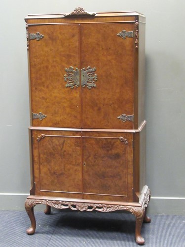 Lot 673 - A 1930's walnut cocktail cabinet, 165 x 80 x 40cm