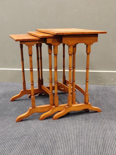 Lot 716 - A nest of three satinwood reproduction tables...