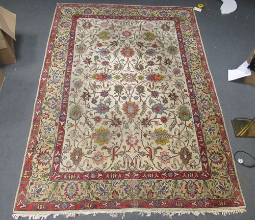 Lot 790 - A Persian design rug with ivory ground and...