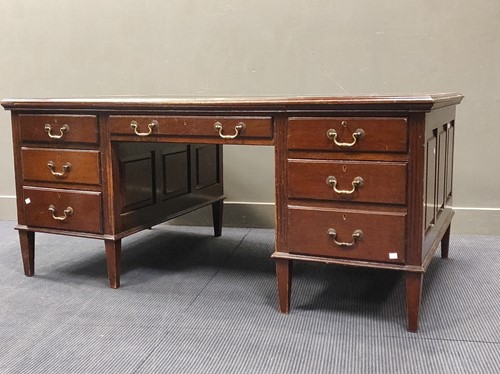 Lot 583 - A mahogany pedestal desk with black leather...