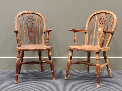 Lot 687 - A pair of childs wheel back windsor armchairs