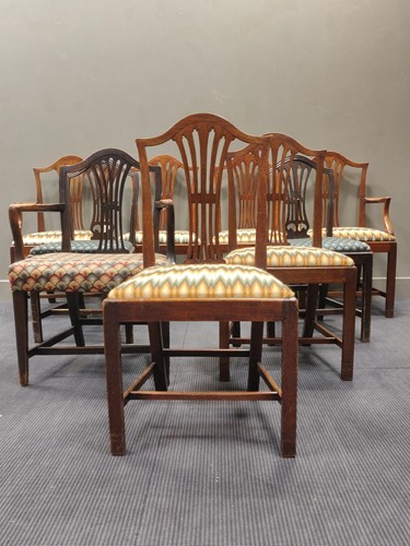 Lot 752 - Nine George III style arched back dining...