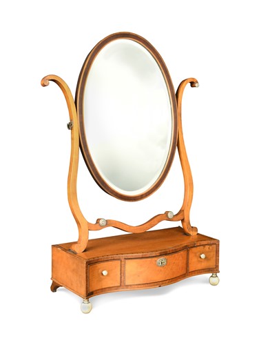 Lot 320 - A George III satinwood serpentine toilet mirror
