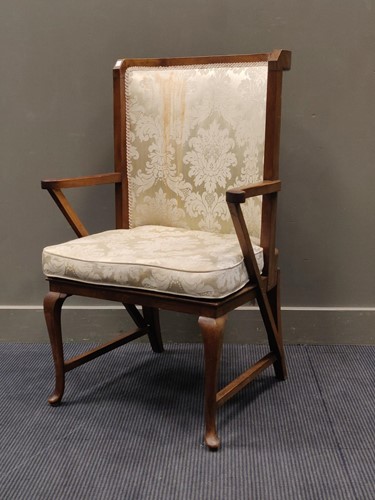 Lot 499 - A mahogany frame highback easy armchair on...