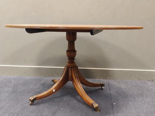 Lot 540 - A yew wood reproduction oval breakfast table...