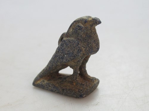 Lot 205 - A carved figure of the Egyptian god, Horus,...