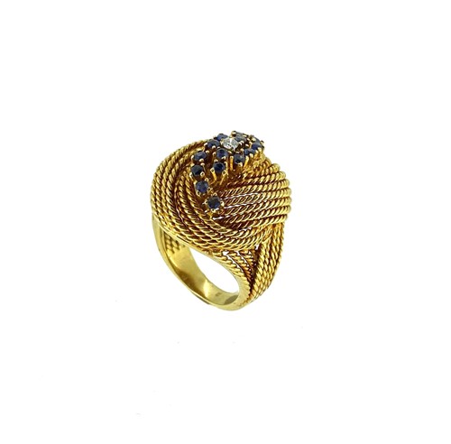 Lot 113 - A late 20th century sapphire and diamond knot style ring