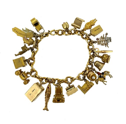 Lot 166 - Cropp & Farr - A late 20th century 9ct gold charm bracelet with charms