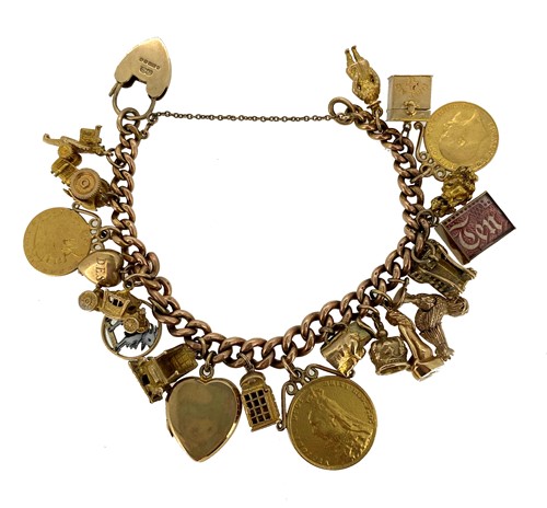 Lot 151 - A late 20th century rose gold charm bracelet with charms