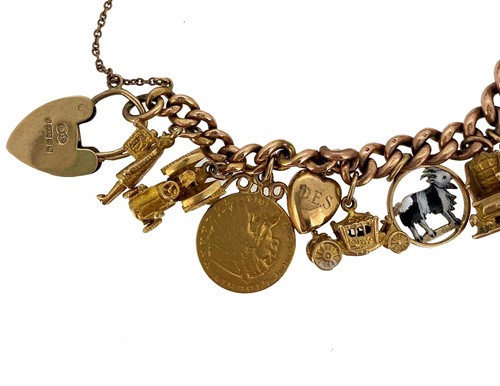 Lot 151 - A late 20th century rose gold charm bracelet with charms