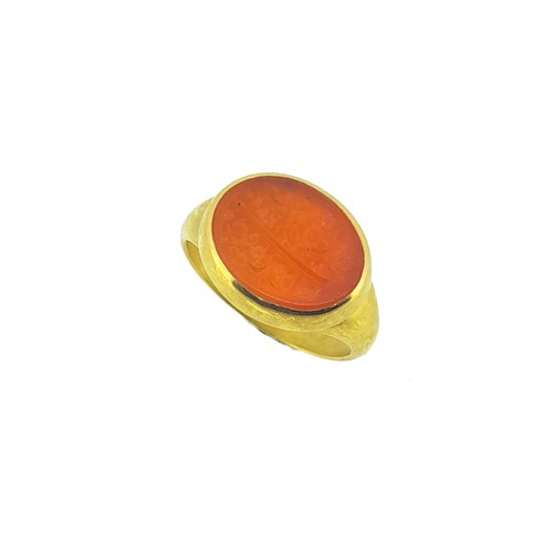 Lot 135 - An 18ct gold Arabic inscribed intaglio ring