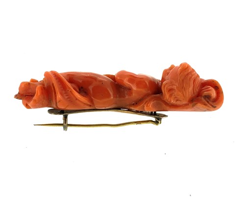 Lot 28 - A 19th century carved coral brooch