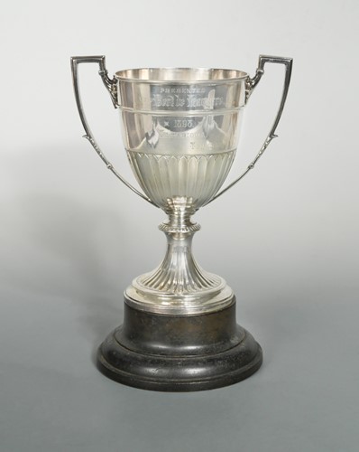 Lot 513 - A Victorian silver two handled trophy cup and stand