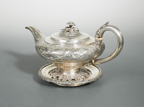 Lot 495 - A George IV silver teapot and stand
