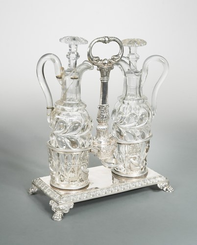 Lot 458 - An early 19th century French metalwares silver oil and vinegar table stand