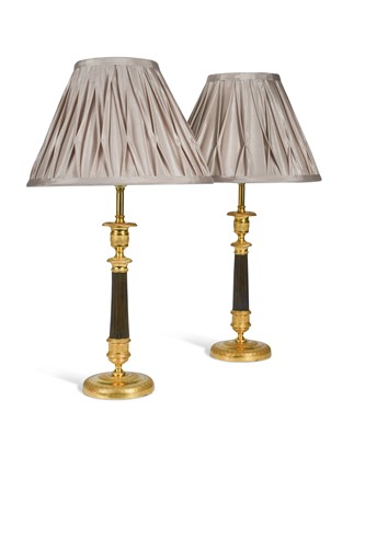 Lot 468 - A pair of Regency bronze and gilt bronze candlestick lamps
