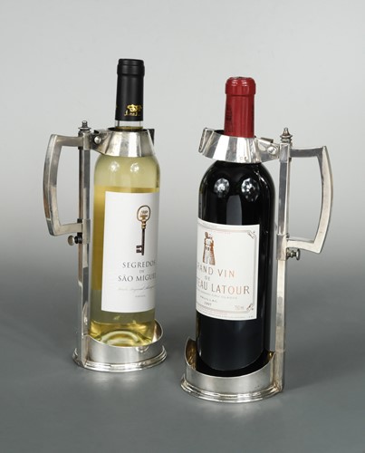 Lot 512 - A Victorian silver wine bottle pourer together with a silver plated example