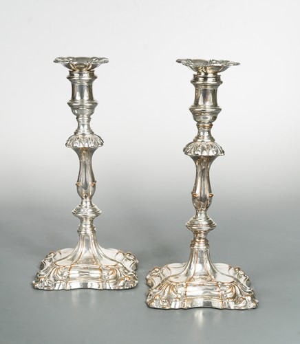 Lot 443 - A pair of 19th century silver plated candlesticks