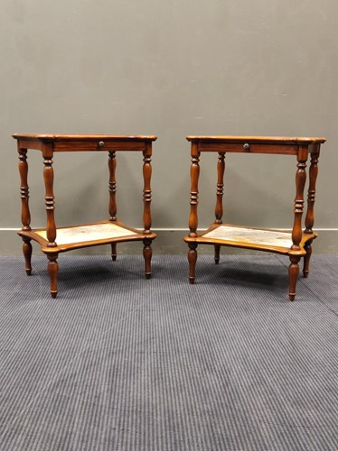 Lot 679 - A pair of two tier lamp tables with marble...