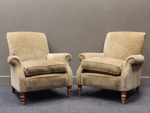 Lot 747 - A pair of armchairs upholstered in animal...