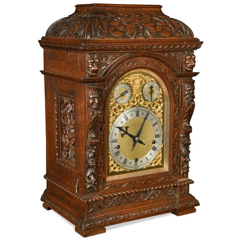 Lot 350 - A late Victorian carved oak case chiming mantel clock