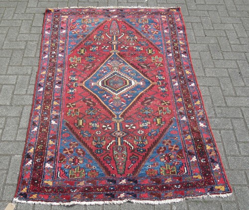 Lot 692 - A Hamadan rug with central pole medallion on...