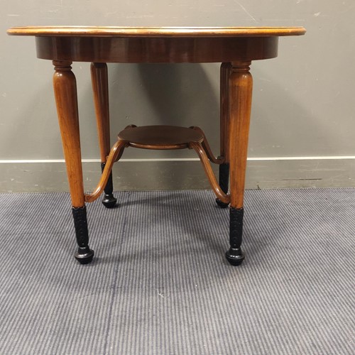 Lot 528 - A Biedermeier style circular table on partly...