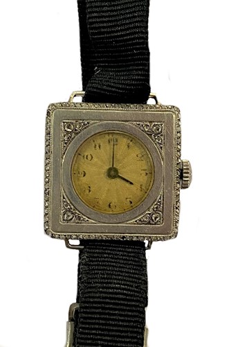 Lot 334 - Unsigned - A French 18ct gold Art Deco diamond set slim case wristwatch
