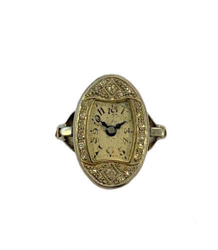 Lot 320 - Unsigned - A platinum and diamond ring watch
