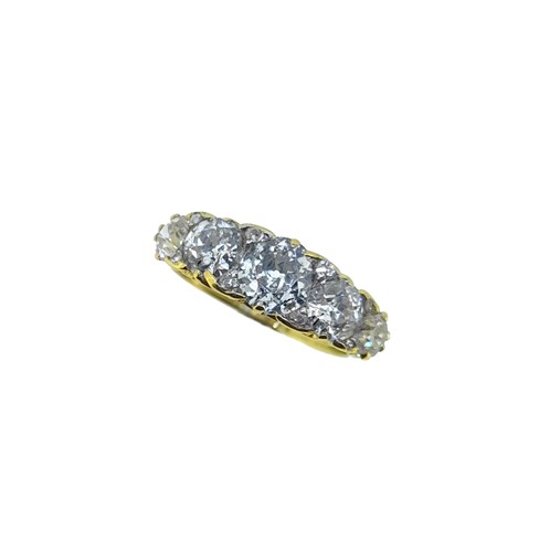 Lot 214 - A carved half hoop style diamond ring