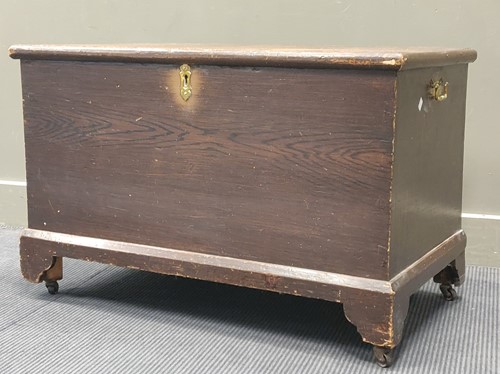 Lot 695 - A simulated oak stained pine blanket chest, on...