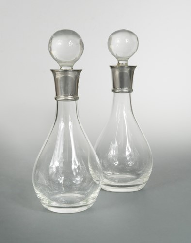 Lot 589 - A pair of 21st century plain crystal claret decanters with silver collars
