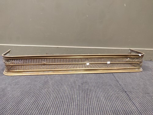 Lot 766 - Two brass fenders one with a mesh grate, and...